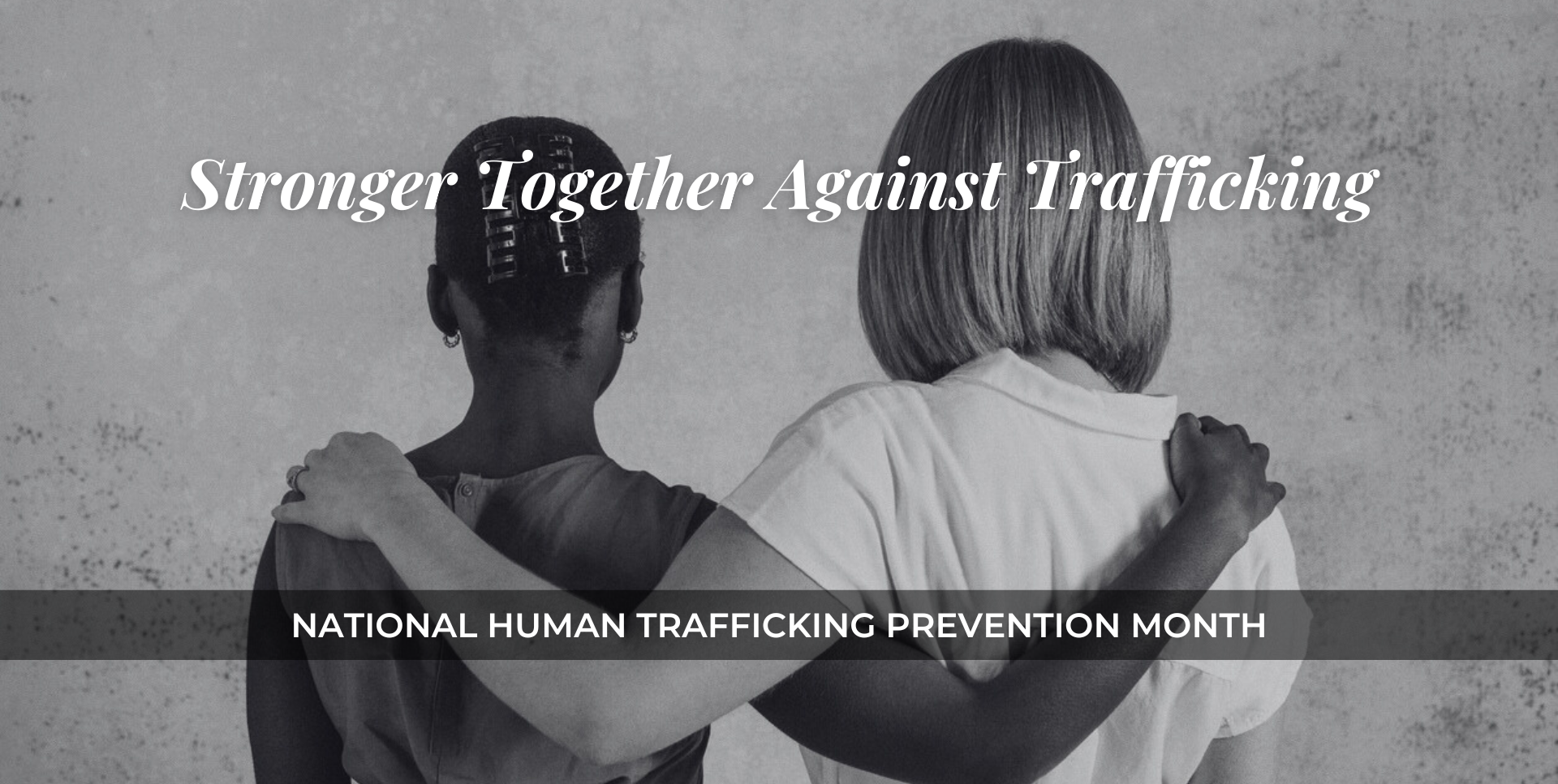 Two women with arms around each other for National Human Trafficking Prevention Month