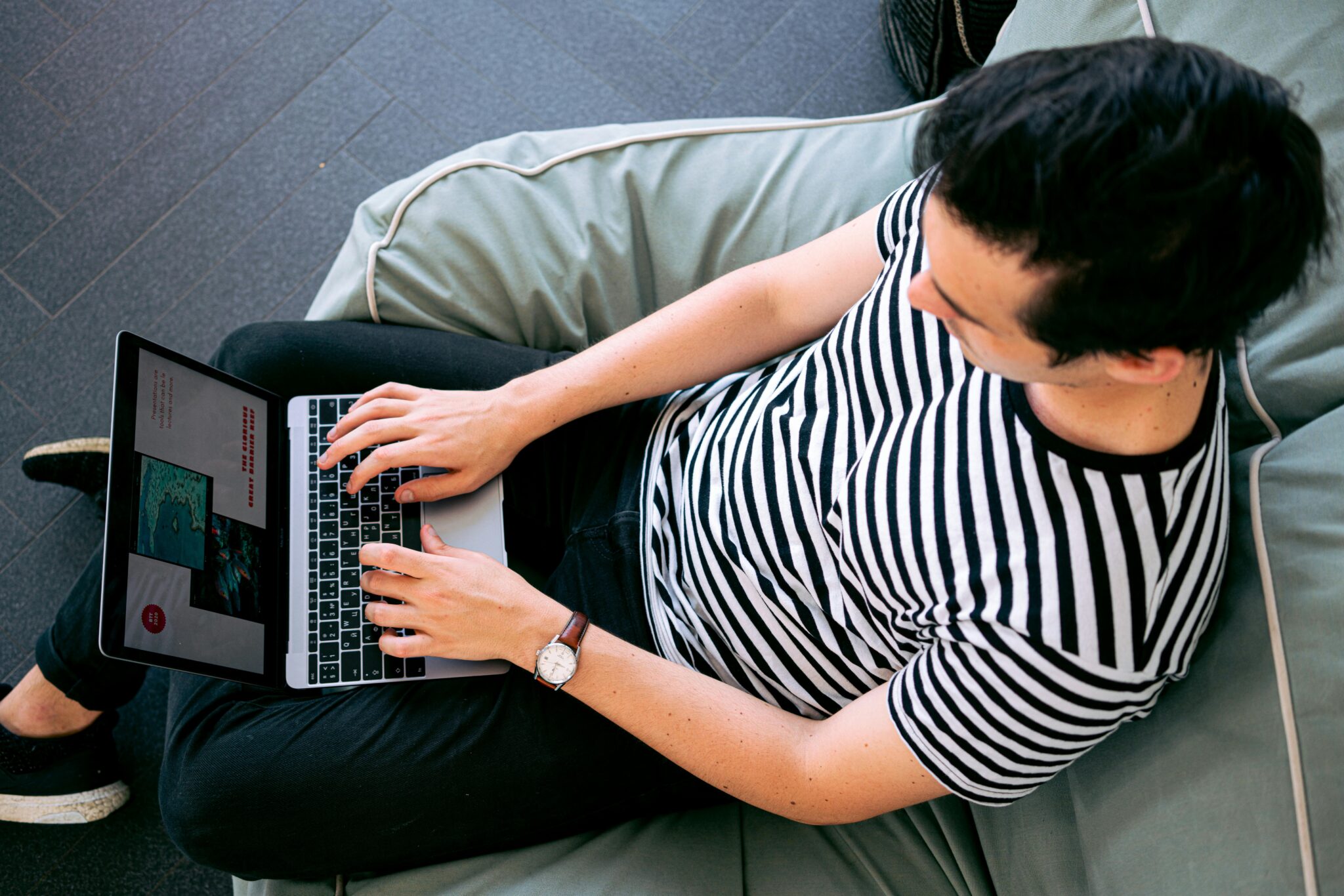 man using laptop illustrating impact of digital technology on trafficking