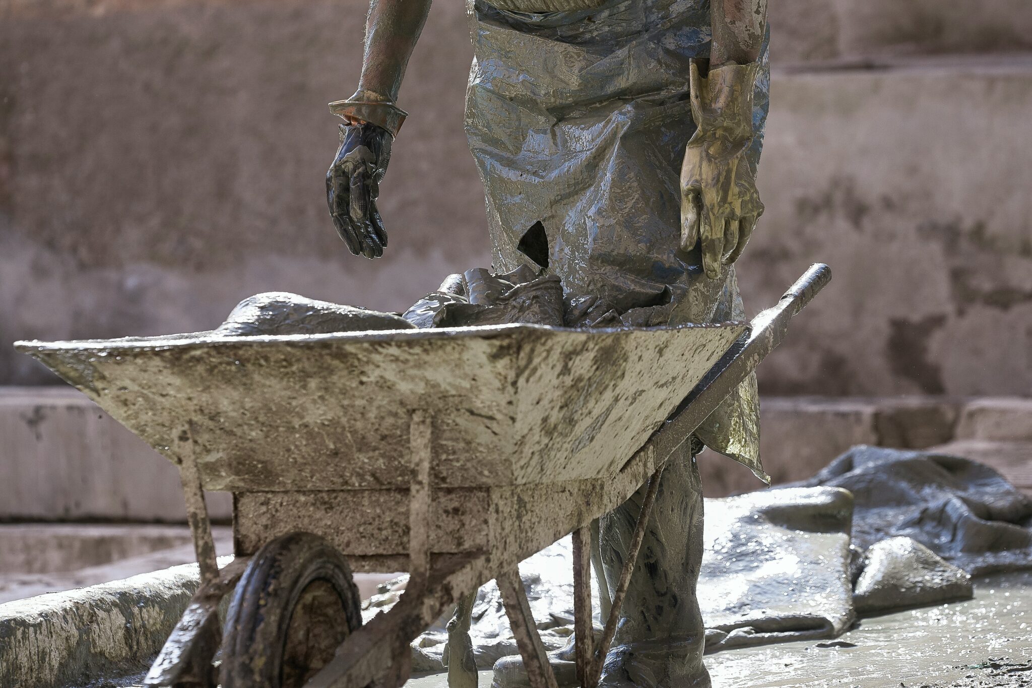 man pushing wheelbarrow illustrating prison labor and human trafficking